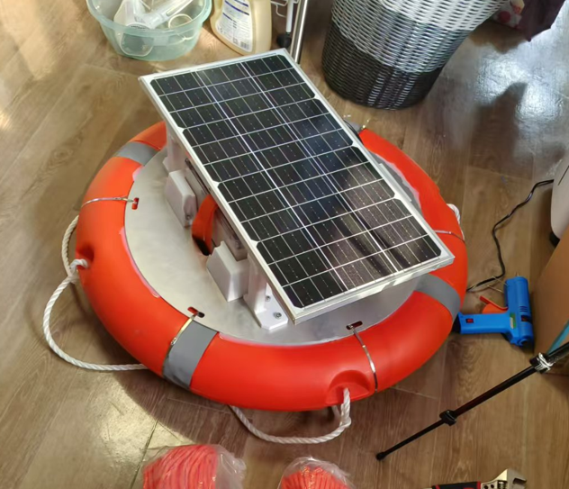Assembled float with the rectangular solar panel mounted above the flotation ring